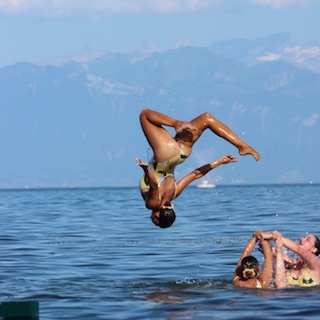 Artistic swimmers performing in the lake at our event LOOP.