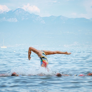 Artistic swimmers performing in the lake at our event LOOP.